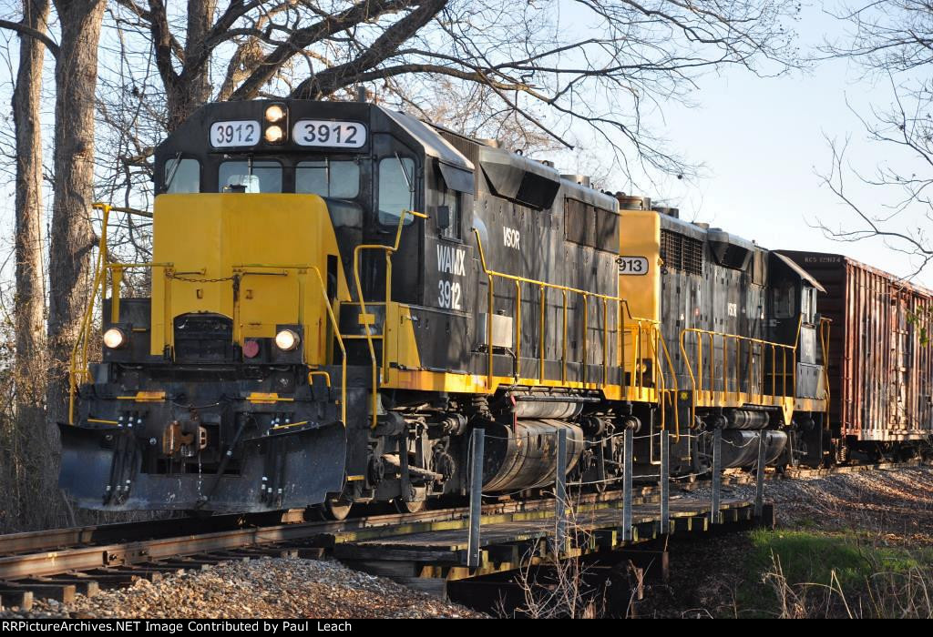 A pair of Geeps work the small yard near the paper mill